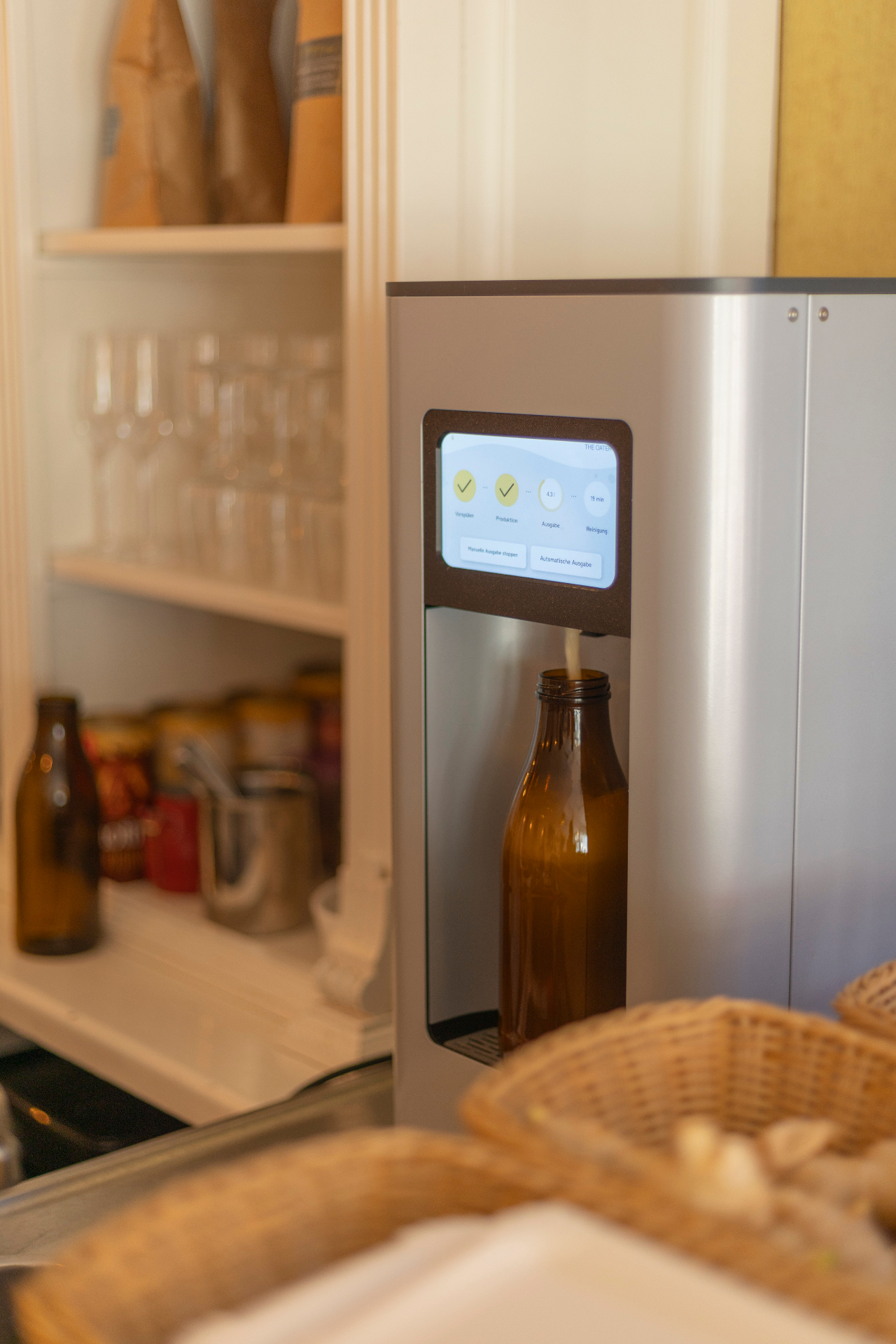 The Oater machine pouring fresh oat drink